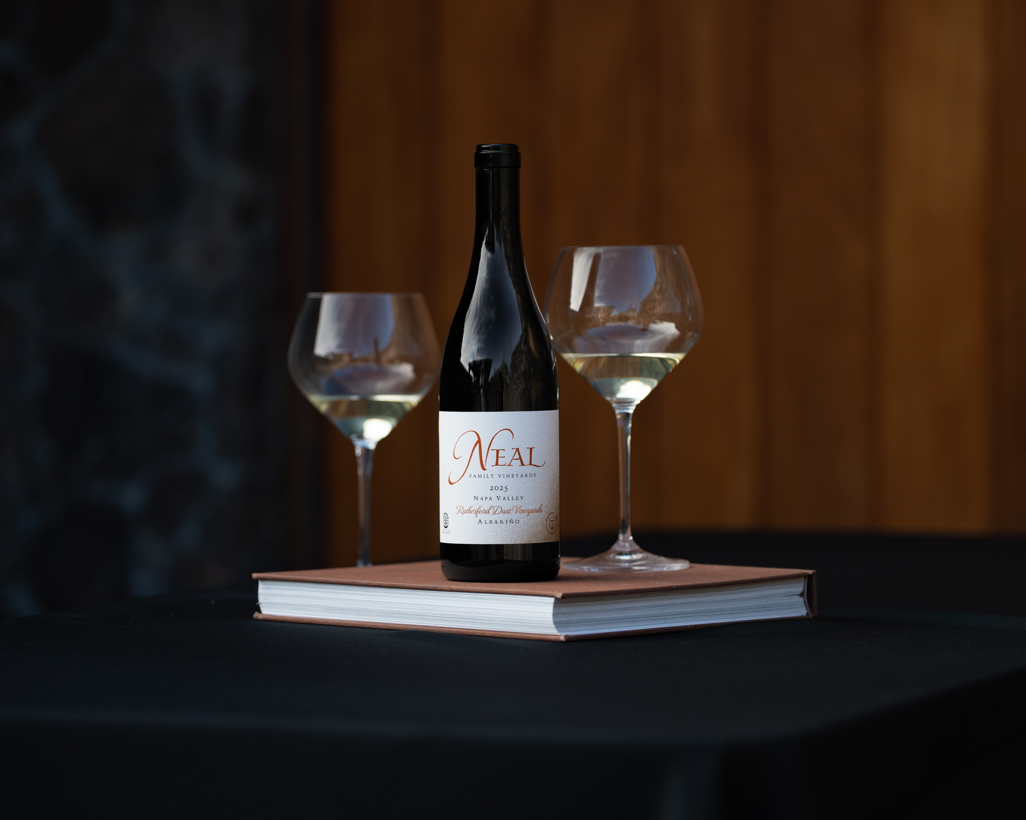 Neal Family Vineyards 2025 Rutherford Dust Vineyards Albarino beside two glasses of white wine